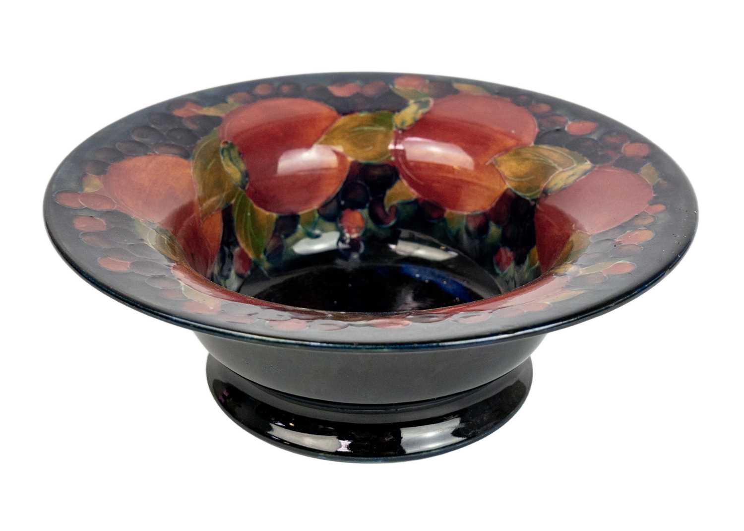 Lot 427 - A Moorcroft pomegranate pattern flared rim