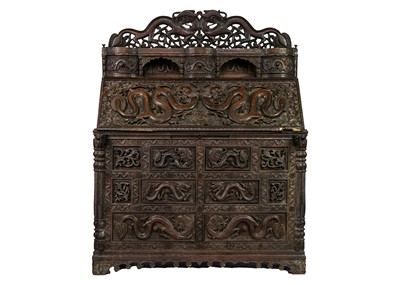 Lot 366 - A Chinese carved hardwood bureau, Qing Dynasty, 19th century.