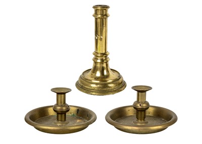 Lot 1099 - A 19th century brass candlestick VR below a crown.