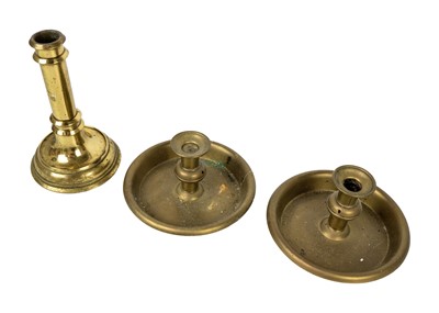 Lot 1099 - A 19th century brass candlestick VR below a crown.