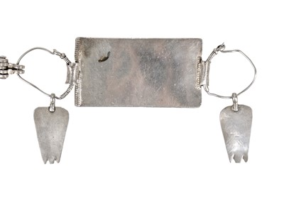 Lot 66 - An Omani silver rectangular amulet with chain.