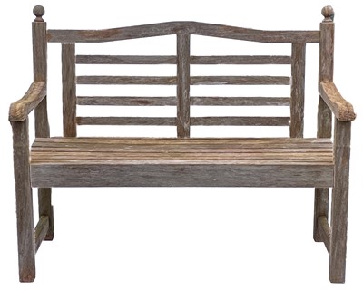 Lot 520 - A garden bench with ball finials.