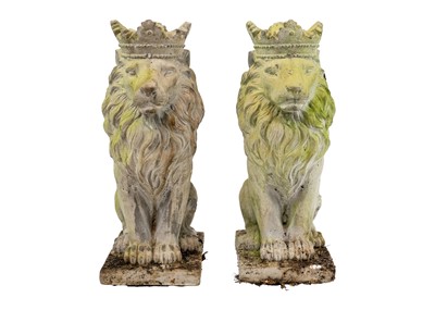 Lot 524 - A pair of reconstituted stone sculptures of seated lions wearing crowns.