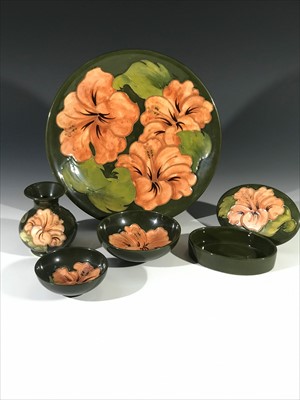 Lot 1002 - A collection of Moorcroft 'Hibiscus' pattern...