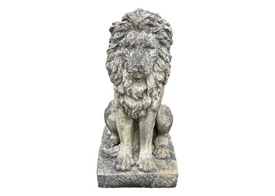 Lot 528 - A cast reconstituted stone statue of a seated lion.