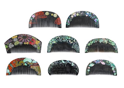 Lot 1020 - Eight Japanese black lacquer combs, 20th century.