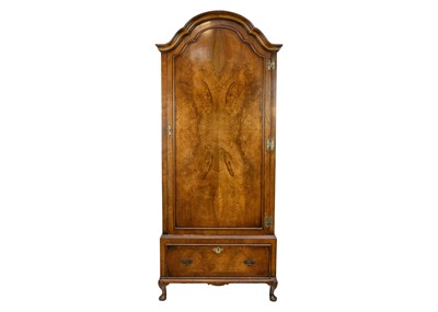 Lot 576 - A Walnut dome top wardrobe.