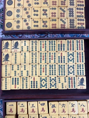 Lot 28 - A mahogany cased mahjong set.