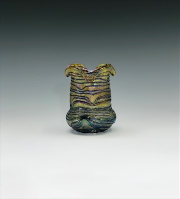 Lot 934 - An early 20th century iridescent glass vase...