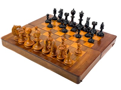 Lot 130 - An ebony and boxwood Staunton pattern chess set.