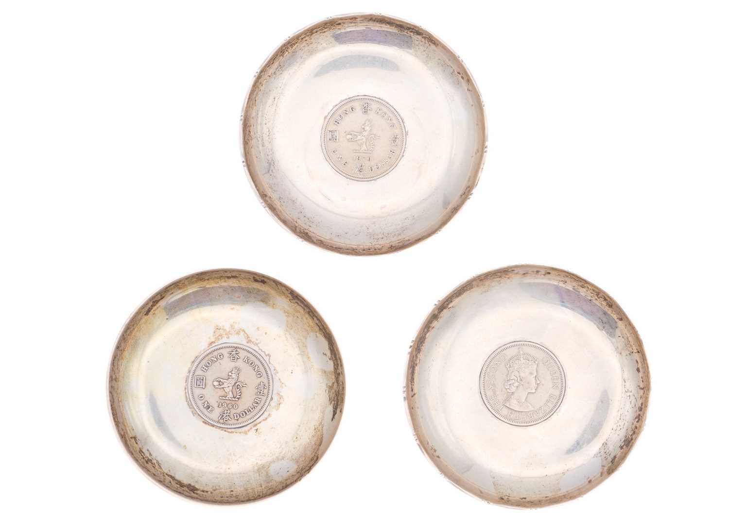 Lot 27 - Three modern Chinese sterling silver pin dishes.