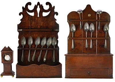 Lot 1062 - A George III oak spoon rack.