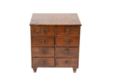 Lot 1375 - A miniature mahogany chest of drawers.