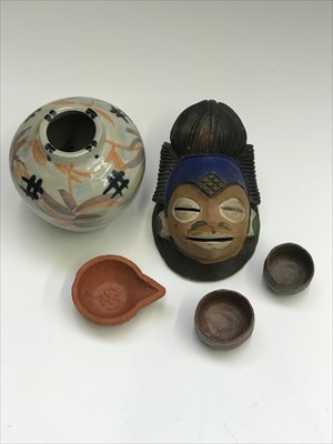Lot 954 - An African painted terracotta mask, height...