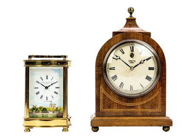 Lot 568 - A Diamond Boutique brass cased carriage clock.