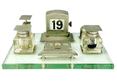 Lot 108 - An unusual and comprehensive Art Deco chrome desk set on a glass base.