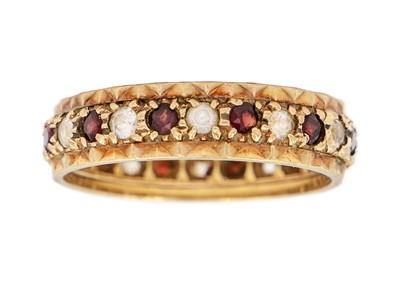 Lot 156 - A 9ct garnet and white stone set full eternity ring.