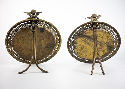 Lot 69 - A pair of late 19th century circular brass frame table mirrors.