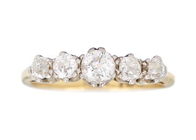 Lot 139 - An 18ct and platinum diamond set five-stone ring.