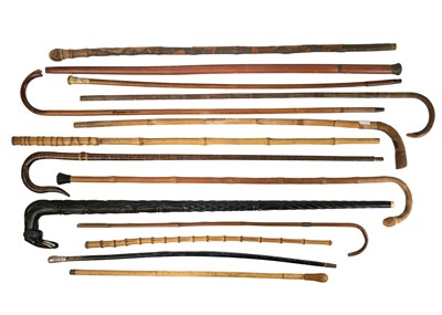 Lot 323 - A selection of walking sticks and canes.