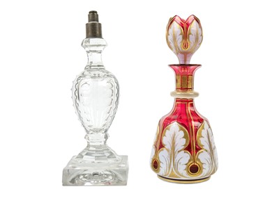 Lot 403 - A Bohemian cranberry flash white overlay glass decanter and stopper.