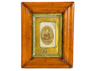 Lot 118 - A Victorian child portrait with first lock of hair.