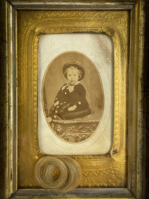 Lot 118 - A Victorian child portrait with first lock of hair.