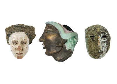 Lot 5 - A trio of pottery faces.