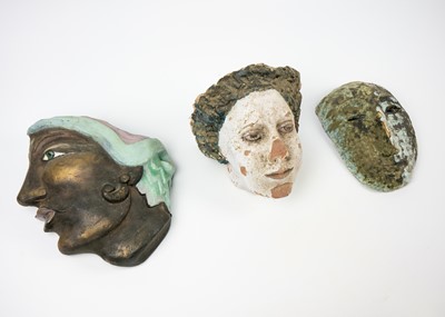 Lot 5 - A trio of pottery faces.