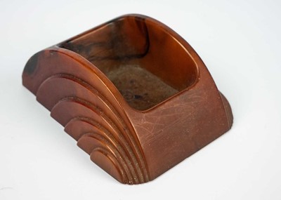 Lot 12 - An Art Deco Cavacraft amber coloured cast phenolic (Bakelite) desktop sponge holder.