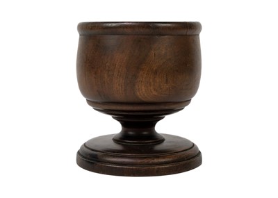 Lot 265 - An 18th century turned treen pedestal wassil cup.