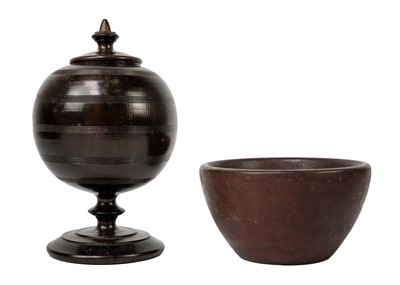 Lot 1088 - A treen turned globe jar and cover on pedestal base.