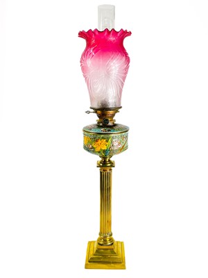 Lot 94 - A Victorian cranberry shade brass oil lamp.