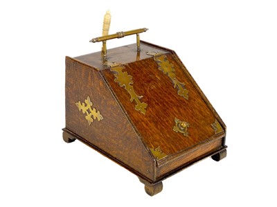 Lot 120 - An early 20th century brass bound oak novelty tea caddy.