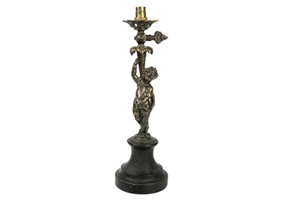 Lot 80 - A French bronze cherub table lamp.