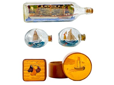 Lot 224 - A model ship in a bottle.