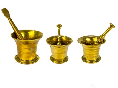 Lot 322 - A brass mortar and pestle.