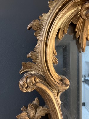 Lot 65 - A carved gilt wood and gesso girandole mirror.