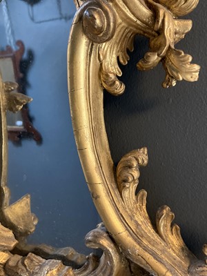 Lot 65 - A carved gilt wood and gesso girandole mirror.