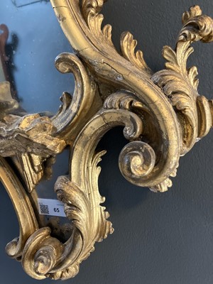 Lot 65 - A carved gilt wood and gesso girandole mirror.