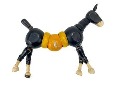 Lot 157 - A carved wood automaton in the form of a seated whipped with 'beating' heart.