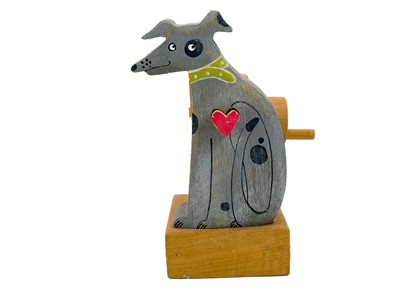 Lot 157 - A carved wood automaton in the form of a seated whipped with 'beating' heart.