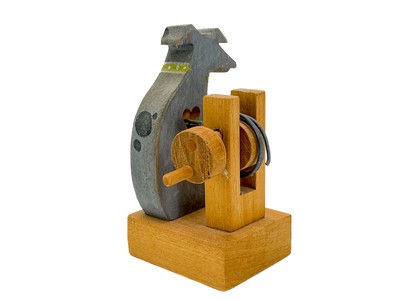 Lot 157 - A carved wood automaton in the form of a seated whipped with 'beating' heart.