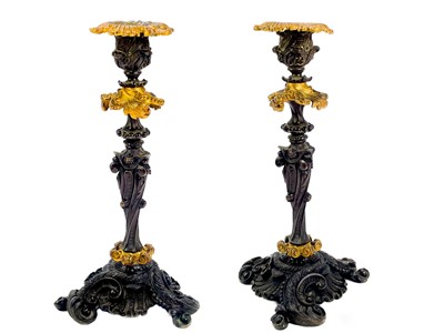 Lot 297 - A pair of late 19th century French patinated gilt bronze rococo style candlesticks