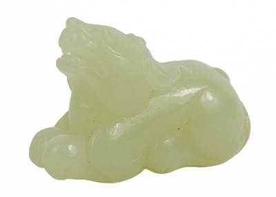 Lot 1036 - A Chinese jade Pixiu, late Qing Dynasty.