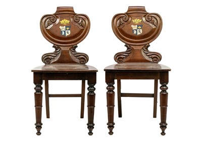 Lot 628 - A pair of Victorian mahogany hall chairs.