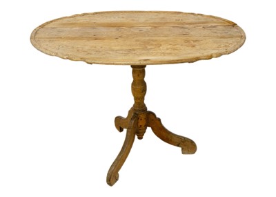 Lot 1044 - An 18th/19th century pine oval tilt top tripod table.