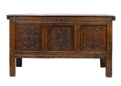 Lot 1093 - An oak panel coffer.