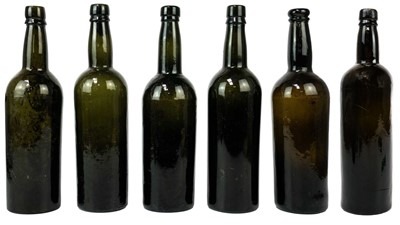 Lot 410 - Six assorted green glass wine bottles.