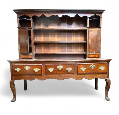 Lot 1090 - A George III oak dresser.